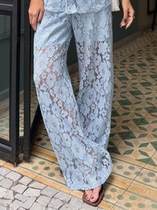 Three-piece light blue lace set featuring high-waisted wide-leg trousers in floral patterns