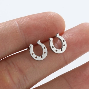 Minimalist silver horseshoe U-shaped stud earrings in polished stainless steel
