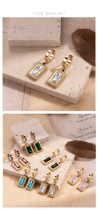 Detailed view of vintage gold earrings featuring multi-colored square zircon stones