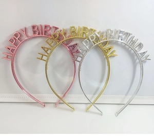 Detailed close-up of pink, gold, and silver Happy Birthday metallic headbands for parties