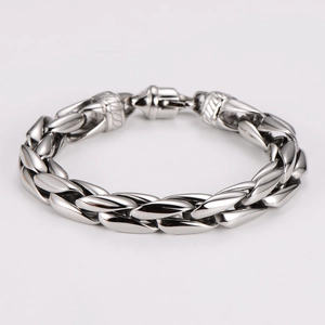 Detail showing polished stainless steel woven chain links of the vintage bracelet