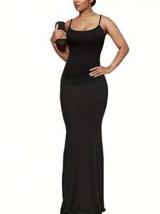 Slim fit black maxi slip dress with thin straps and floor length fishtail hem