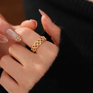 18k gold plated hollow cross ring with sparkling zircon stones worn on finger