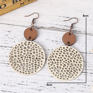 Detail view of retro geometric wooden earrings with dimensions 8cm by 4cm