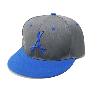 Macro shot of 3D embroidered blue letter A on a grey and blue snapback flat brim cap