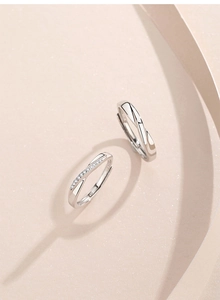 Macro detail of S925 sterling silver Mobius rings with one pavé diamond band