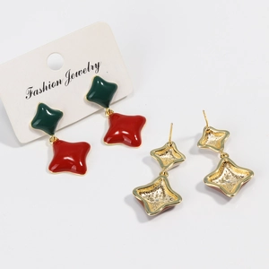 Vintage gold-plated four-point star drop earrings with red and green enamel inlay