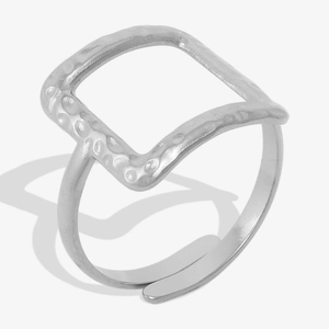 Detail of silver 304 stainless steel open ring with irregular hammered texture on square top