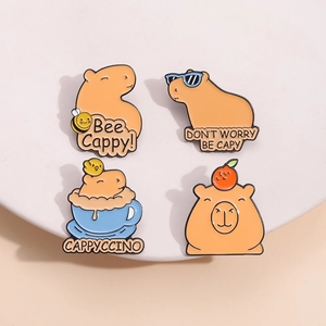Cute capybara enamel pins collection featuring bee, sunglasses, and orange designs