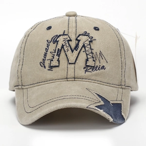 Khaki washed canvas baseball cap with embroidered letter M and vintage star patch details