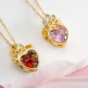 Titanium steel heart pendant necklace with gold crown and faceted red pink gemstones
