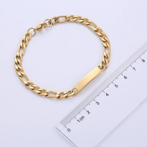 Close-up of golden stainless steel blank bar bracelet with 1cm wide Figaro chain link