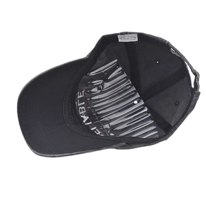 Detail view of cotton baseball cap interior featuring sweatband and adjustable strap