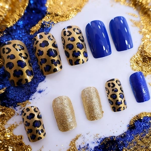 Chic blue leopard print press-on nails with golden glitter, trendy medium-length design