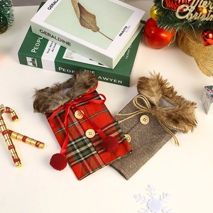 Detail of Christmas wine bottle covers with faux fur collars and wooden button accents