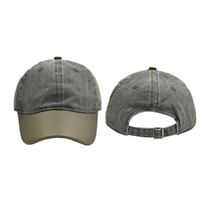 Detail of washed cotton baseball cap with green leather brim and metal adjustment buckle