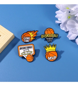 Detail of four basketball enamel pins set including MVP and GAME TIME sports badges