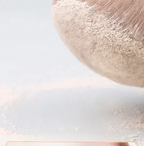 Macro detail of soft brown bristles with powder showing high pickup capability