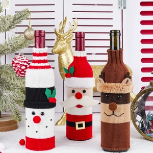 Knitted Christmas wine bottle covers featuring Santa, Snowman and Reindeer holiday designs