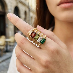 Set of five gold twist rings with colorful rectangular zircon stones for layered styling