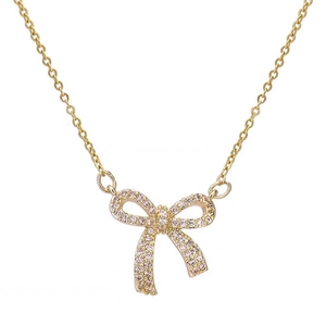 Exquisite gold necklace featuring a delicate bow pendant inlaid with pink zircon stones
