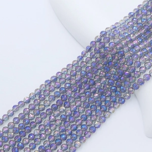 Macro shot of 4mm faceted purple and blue crystal glass beads for jewelry making