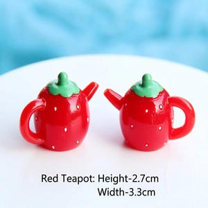 Macro detail of red strawberry miniature resin teapot with dimensions 2.7cm by 3.3cm