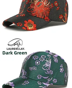 Detail of floral embroidery and jacquard patterns on two ethnic style baseball caps