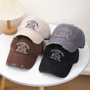 Distressed vintage baseball caps with rabbit embroidery and ripped edge details