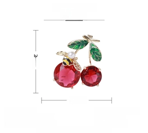 Detailed view of cherry brooch with red zircon, gold bee and pearl, size 29mm x 25mm