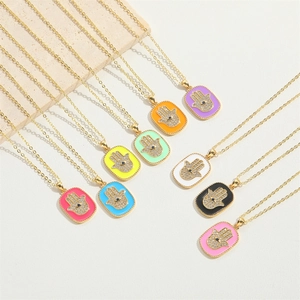 Colorful Hamsa Hand enamel necklaces with sparkling crystal eye pendants in gold finish