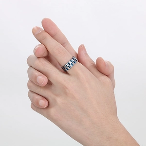 Men's titanium steel ring featuring silver and blue water ripple design on finger