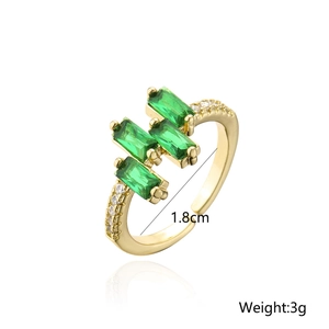 Detail view of 18K gold plated ring featuring green zircons with 1.8cm diameter and 3g weight