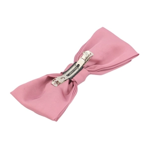 Pink double-layered satin bow headband with handmade label on clean white background