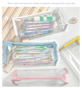 Macro shot showing four colorful transparent PVC bags filled with pens and stationery
