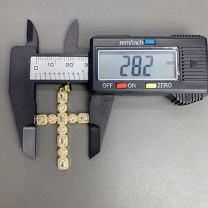 Detailed dimension shot showing the 28.2mm width of the gold zircon cross pendant
