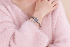 Detail of silver stainless steel Hamsa Hand bracelet with sparkling crystals on wrist