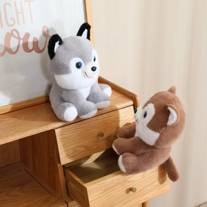 Close-up of soft plush husky and lion dolls with detailed embroidery and realistic eyes