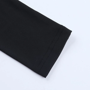 Detailed macro view of black elastic cuffs featuring durable double-stitch sewing