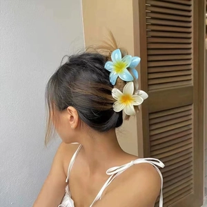 Frangipani flower hair claw clip set in blue and cream with a natural gradient effect
