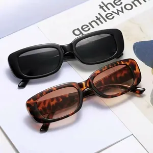 Retro rectangle sunglasses in black and tortoiseshell finish on minimalist magazine