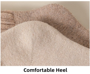 Macro detail of the thickened wool blend knit heel on a warm men's thermal winter sock