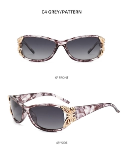 Detail of Y2K polarized sunglasses with decorative gold butterfly and grey pattern frame