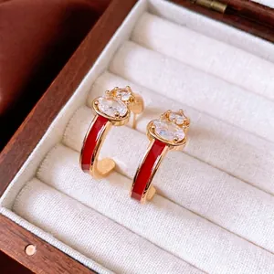 Elegant 18k gold plated gourd earrings with red enamel and sparkling zircons