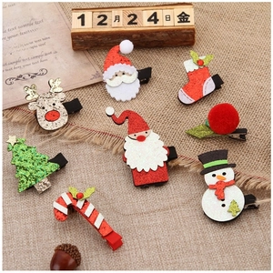 8-piece festive Christmas hair clip set with reindeer and Santa designs for girls