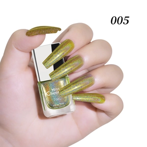Close-up of 7ml shimmering gold laser nail polish bottle held by hand with long nails