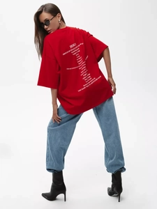 Close-up of Jesus letter print on the back of this oversized red 100% cotton T-shirt