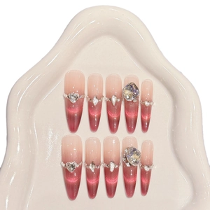Handmade press-on nails with pomegranate ice cat-eye gradient and sparkling luxury crystals