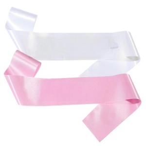 Close-up of Bride to Be and Bride tribe glitter sashes in white and pink satin fabric