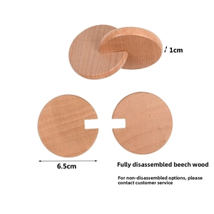 Macro detail of natural beech wood interlocking discs with 6.5cm diameter for toy assembly